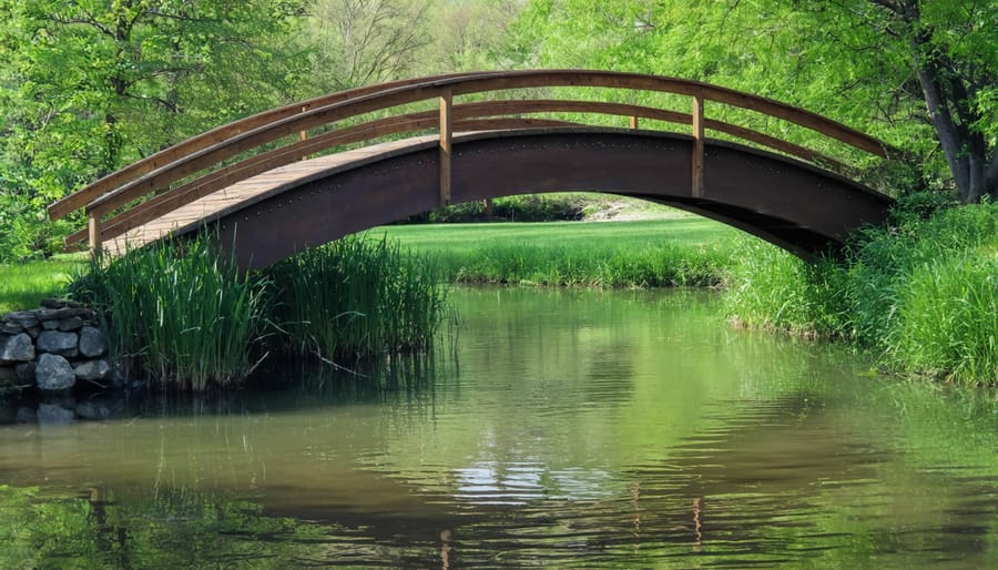 Wooden bridge crossing over a peaceful backyard pond