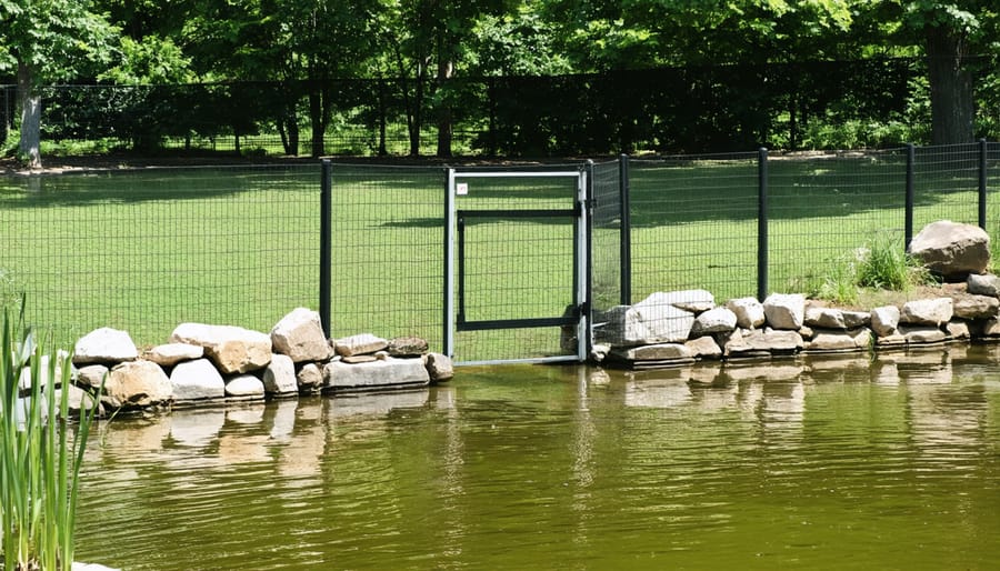 Child-proof garden pond fence installation with secure gate mechanism