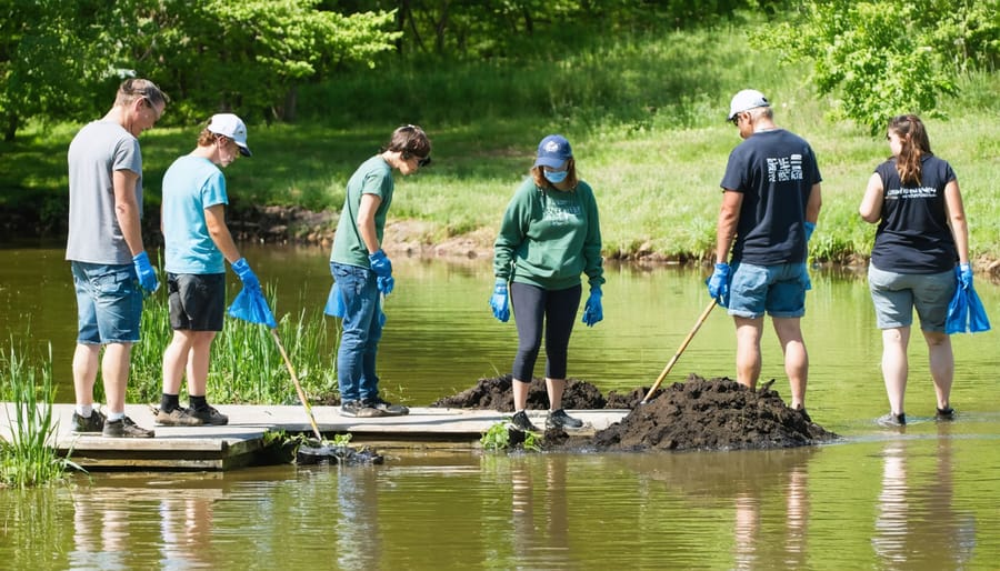 Group of local volunteers working together to maintain pond areas and collect data