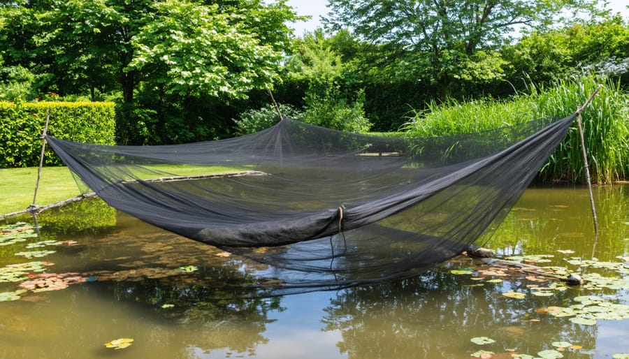 Protective pond netting installed over a garden pond with stone edging